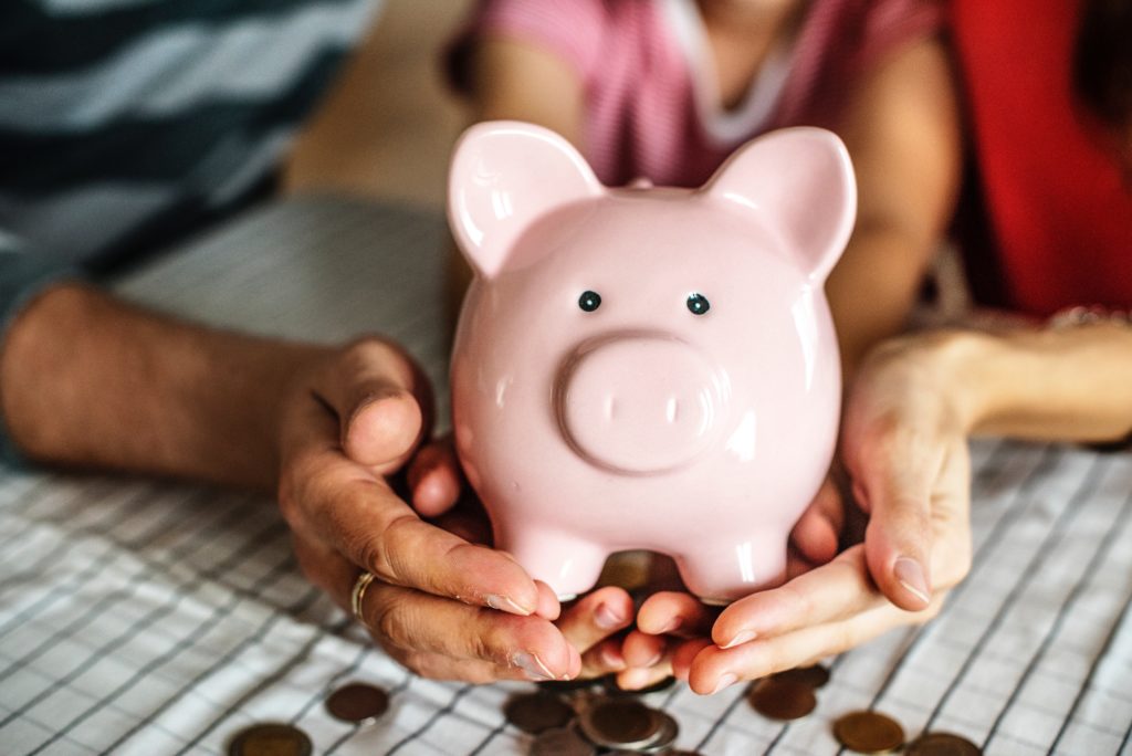 selective focus photo of pink ceramic piggy bank ( tips to save money)