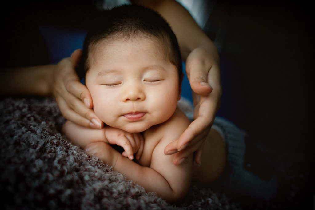 a worried mother checking on the baby is may baby normal