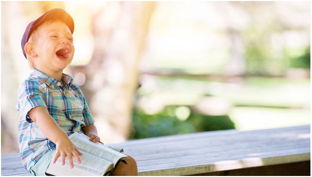 a child laughing his heart out...... gratitude raises happiness set point