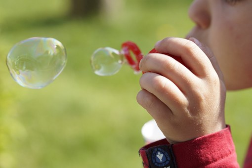 kid blowing bubble; Activities for toddlers 