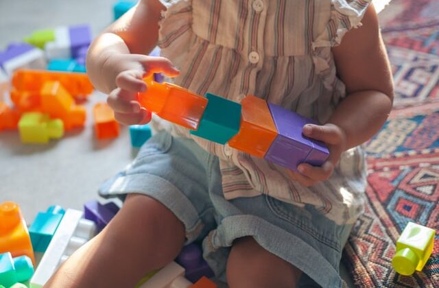 preschooler playing with blocks