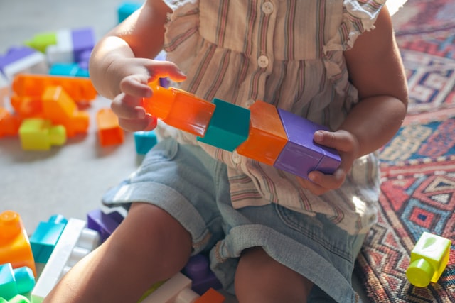 preschooler playing with blocks